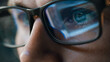 © Gorodenkoff - Close-up Portrait of Software Engineer Working on Computer, Line of Code Reflecting in Glasses. Developer Working on Innovative e-Commerce Application using Machine Learning, AI Algorithm, Big Data