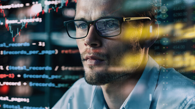 Close-up Portrait of Software Engineer Working on Computer, Line of Code Run Aroung Him. Developer Working on Innovative e-Commerce Application using Big Data Concept