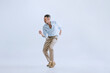 © master1305 - Portrai of young man, hipster or dandy dancing rock-and-roll or swing isolated on white background. retro vintage style