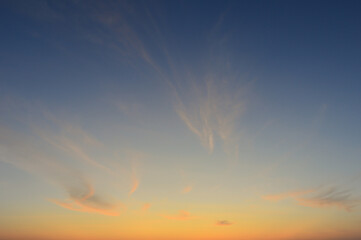 Wall Mural - beautiful vivid sky painted by the sun leaving bright golden shades.dense clouds in twilight sky in 