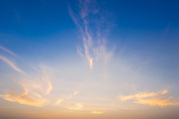 Wall Mural - beautiful vivid sky painted by the sun leaving bright golden shades.dense clouds in twilight sky in 
