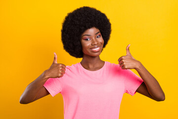 Wall Mural - Photo of young african girl happy positive smile show thumbs-up fine suggest ad isolated over yellow color background