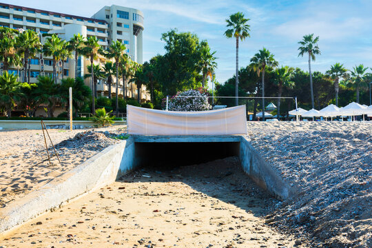 drainage tunnel on antalya side beach. Selective Focus.
