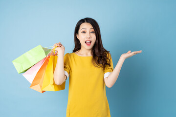 Wall Mural - Asian woman portrait in need of a shopping bag