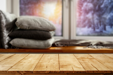 Wooden table on the background of the window, beautiful winter season in the evening Christmas day 