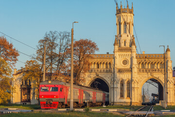 Wall Mural - Railway station building facade at autumn sunset. It was built in 1855-1857 yy. Petergof (near Saint Petersburg).