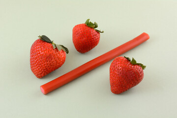 Poster - Strawberry licorice stick with fresh raw strawberries on light green background