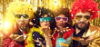 © Studio Romantic - Happy merry people dressed in Afro wigs and glasses celebrating Christmas, New Year, birthday or Xmas Eve at disco night club party sharing groovy festive mood blowing you shiny golden confetti kiss