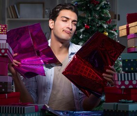 Canvas Print - Man with many christmas gifts in boxes