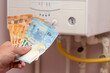 European energy crisis. increase in gas prices in Europe for the population. Euro banknotes in front of a burning boiler