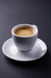 © Eugeniusz Dudziński - Cup of coffee on dark paper background. Close up.