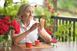 © aletia2011 - Portrait of a happy aged woman talking on smartphone