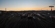 Dusk panorama of switch yard in Hagen Vorhalle, Germany. multiple freight trains and waggons are standing on the rails.