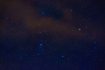 Wall Mural - constellation of Orion on the background of a blue starry sky. Astrophotography of stars, galaxies and nebulae at night