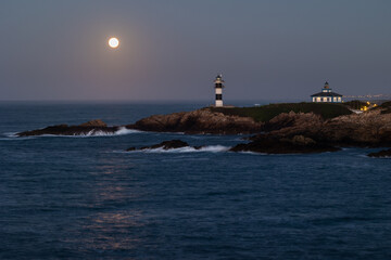 Wall Mural - November Full Moon over the Illa Pancha lighthouse and hotel, in Ribadeo, Galicia, Spain!