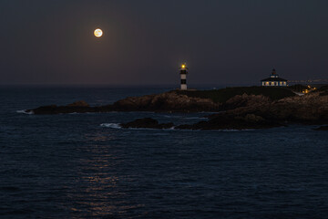 Wall Mural - November Full Moon over the Illa Pancha lighthouse and hotel, in Ribadeo, Galicia, Spain!