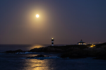 Wall Mural - November Full Moon over the Illa Pancha lighthouse and hotel, in Ribadeo, Galicia, Spain!