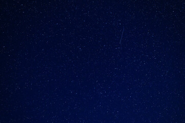 Wall Mural - Shooting star meteorite comet on the background of a blue starry sky with constellations, nebulae and galaxies