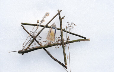 Poster - crystal mineral and pentagram made of tree branches on snow natural background. Gemstones for esoteric Crystal Ritual, Witchcraft, spiritual energy practice. Wiccan tradition for winter season