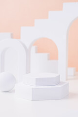 Aufkleber - Geometric pedestal block on white table and pastel peach background.mockup for display product