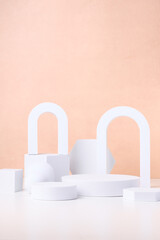 Aufkleber - Geometric pedestal block on white table and pastel peach background.mockup for display product