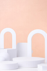 Aufkleber - Geometric pedestal block on white table and pastel peach background.mockup for display product