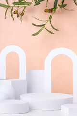 Aufkleber - Geometric pedestal on table and olive leaf on pastel peach background.mockup for display product