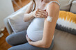 © Graphicroyalty - Adhesive bandage on arm after injection vaccine or medicine,ADHESIVE BANDAGES PLASTER - Medical Equipment,Soft focus Adhesive bandage on a Pregnant female brachium after covid-19 vaccination