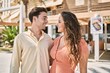 © Krakenimages.com - Man and woman couple smiling confident and hugging each other at street