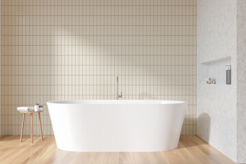 Light bathroom interior with bathtub on parquet floor, table with gels