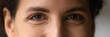 © fizkes - Close up cropped shot of young smiling woman face with beautiful eyes. Good vision and eye care. Contact lenses. Natural female beauty. Eye contour treatment cosmetic line. Wide horizontal web banner