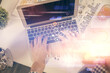© peshkova - Multi exposure of man's hands typing over computer keyboard and data theme hologram drawing. Top view. Technology concept.