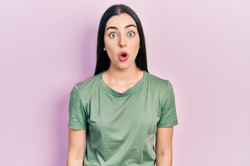 Canvas Print - Beautiful woman with blue eyes wearing casual t shirt afraid and shocked with surprise expression, fear and excited face.