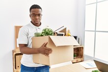 Young African Man Fired Holding Box With Personal Items At Business Office