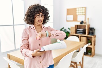 Sticker - Young middle eastern woman wearing business style at office looking at the watch time worried, afraid of getting late