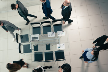 Wall Mural - top view. group employees go to the conference room