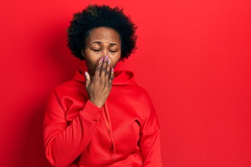 Wall Mural - Young african american woman wearing casual sweatshirt bored yawning tired covering mouth with hand. restless and sleepiness.