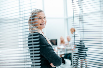 Wall Mural - confident woman Manager standing in spacious office.