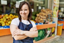 Young Down Syndrome Woman Smiling Confident Wearing Apron At Fruit Store