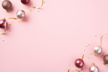 Top View Photo Of Pink Christmas Tree Decorations Balls Gold Serpentine And Shiny Sequins On Isolated Pastel Pink Background With Copyspace