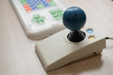 Close-up of a specialized computer mouse and keyboard for people with cerebral palsy.