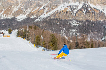 Wall Mural - Alpine skier on slope at Cortina