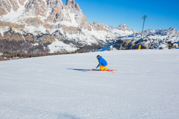 Wall Mural - Alpine skier on slope at Cortina