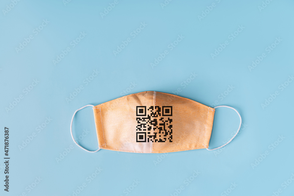 Beige safety mask with qr code on blue background
