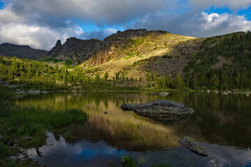 Wall Mural - Russia. Krasnoyarsk Territory. Reflections of harsh rocks in the lakes of the Ergaki Natural Mountain Park.