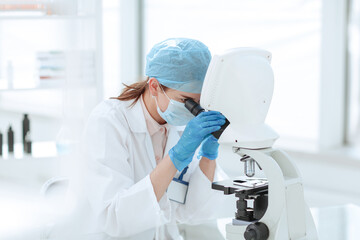 Poster - female scientist conducts research in the laboratory.