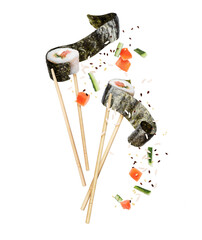 Wall Mural - Two unwrapped sushi rolls sandwiched between chopsticks with ingredients close-up