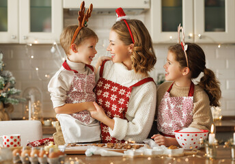 Poster - Happy funny family mother and children enjoying Christmas time at home, baking xmas cookies