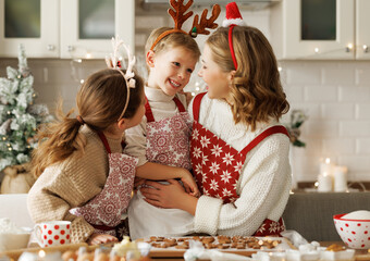 Poster - Happy funny family mother and children enjoying Christmas time at home, baking xmas cookies