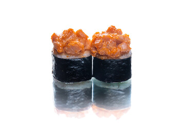 Wall Mural - Two pieces of Japanese Maki sushi roll with nori seaweed with salmon on top. Side view of roll dish isolated on white background. Copy space menu image
